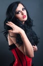 brunette in red corset fur and long hair in s