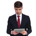 businessman looking seductively while holding a tablet Royalty Free Stock Photo