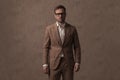 Businessman wearing a nice brown suit and eyeglasses Royalty Free Stock Photo