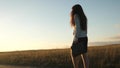 Sexy businesswoman girl running in the countryside. business woman walking along a country road with a briefcase in her Royalty Free Stock Photo