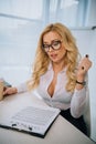 sexy businesswoman reading working