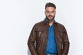 Sexy casual man wearing a brown leather jacket Royalty Free Stock Photo