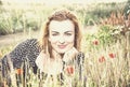 caucasian woman and corn poppy flowers, beauty filter Royalty Free Stock Photo