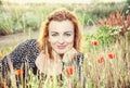 caucasian woman and corn poppy flowers Royalty Free Stock Photo