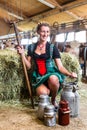 Countrywoman in cowhouse Royalty Free Stock Photo