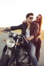 couple of bikers on the vintage custom motorcycle Royalty Free Stock Photo