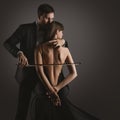 Sexy Couple Kiss. Musician Man with Violin Bow playing Cello Woman Body. Classical Love Music Artist Perform over Black. Art Photo Royalty Free Stock Photo