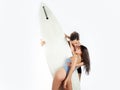 Sexy couple with surfboard. Happy sensual couple surfers going together to surf.