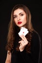 curly hair brunette posing with two aces cards in her hands, poker concept isolation on white background Royalty Free Stock Photo