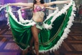 Sexy exotic belly dancers in traditional clothes with silk skirts performing at dance hall event in restaurant, beautiful woman