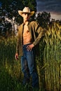 Sexy farmer or cowboy with unbuttoned shirt Royalty Free Stock Photo