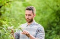 Sexy farmer cut flowers with pliers. Eco farm worker. Harvest. happy earth day. Eco living. farming and agriculture