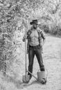 Sexy farmer hold shovel and watering can. muscular ranch man in cowboy hat. happy earth day. Eco living. farming and