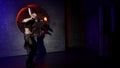 sexy female dancer is dancing alone in dark studio with modern decoration