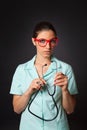 female doctor with a stethoscope and red glasses Royalty Free Stock Photo