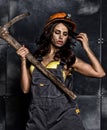 female miner worker with pickaxe, in coveralls over his naked body Royalty Free Stock Photo