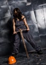 female miner worker with pickaxe, in coveralls over his naked body. erotic industry concept Royalty Free Stock Photo