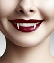 female vampire lips. Halloween background with red blood makeup lip. Masquerade look with terrible