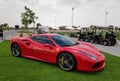 Red ferrari in parking slot