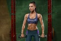 fitness girl working out in gym. Muscular woman, abs, shaped abdominal