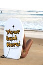 girl in the beach watching the surfers Royalty Free Stock Photo