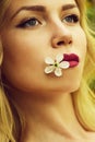 girl hold cherry flower in mouth, spring Royalty Free Stock Photo