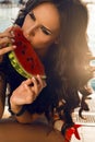 girl with dark hair eating watermelon Royalty Free Stock Photo