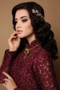 girl with dark hair wears elegant lace dress, luxurious necklace and tiara Royalty Free Stock Photo