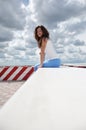 Sexy girl on dramatic sky background. weather forecast. happy woman relax on viewpoint. summer holiday and vacation. female spring Royalty Free Stock Photo