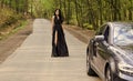 Sexy girl elegant dress at road. Escort concept. Glamorous girl and luxury car. Escort and sexual services. Driver girl