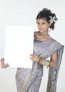 girl in fancy sari holding white board Royalty Free Stock Photo