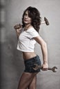 girl holding hammer and wrench spanner Royalty Free Stock Photo