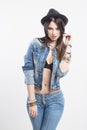 girl in jeans vest and hat Royalty Free Stock Photo