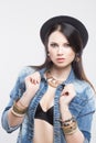 girl in jeans vest and hat Royalty Free Stock Photo