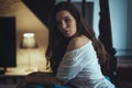 girl leaning on a chair in a living room Royalty Free Stock Photo