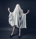 Sexy Girl with long legs in costume Spooky white ghost. Halloween minimal concept