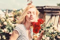 Sexy girl with red rose. beautiful woman with blonde hair in garden. natural beauty. Spa and skincare. summer and spring