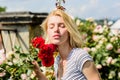 Sexy girl with red rose. beautiful woman with blonde hair in garden. natural beauty. Spa and skincare. summer and spring