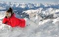 girl resting from skiing on top of mountain Royalty Free Stock Photo