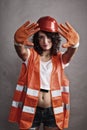 girl in safety helmet showing stop sign Royalty Free Stock Photo