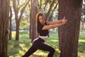 girl stretching hamstrings and calves in the park