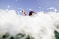 girl swim sea waves hands up splash back view Royalty Free Stock Photo