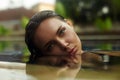 sexy girl in swiming pool on vacation. young beautiful woman relaxing in water