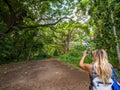 Sexy girl walks into the tropical forest of Honolua Bay in Maui Hawaii Royalty Free Stock Photo