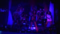 go go girls in black bikini synchronously dance in nightclub. Ultraviolet