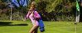 Sexy golfer. Beautiful hot and sexy female golf player posing seductively on golf course Royalty Free Stock Photo