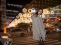 Sexy gorgeous brunette girl portrait in night city lights. Vogue fashion style portrait of young pretty beautiful woman Royalty Free Stock Photo