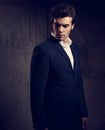 handsome male model posing in blue fashion suit and white s Royalty Free Stock Photo