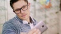 sexy Handsome young man in glasses, spectacles makes selfie at optical store, optics, optician retail store, Eyeglasses Royalty Free Stock Photo