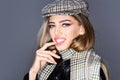 Sexy lady in fashionable outfit, close up. Woman on seductive face with make up with checkered accessories. Fashion Royalty Free Stock Photo